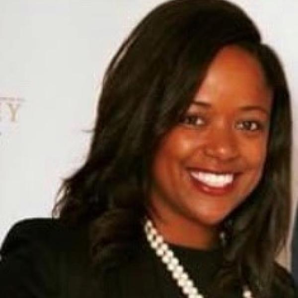 Nestlé employee smiling at the camera 