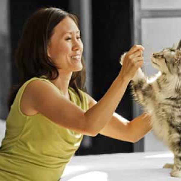 Woman playing with her cat