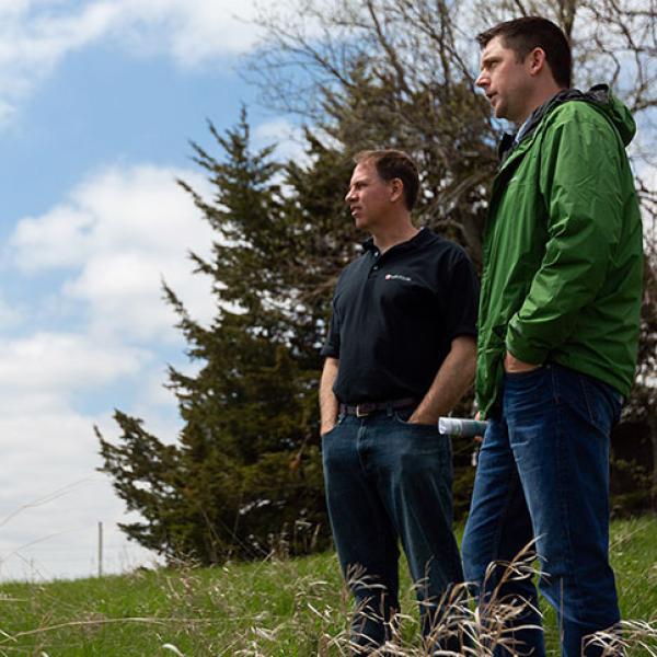 Two males standing outside