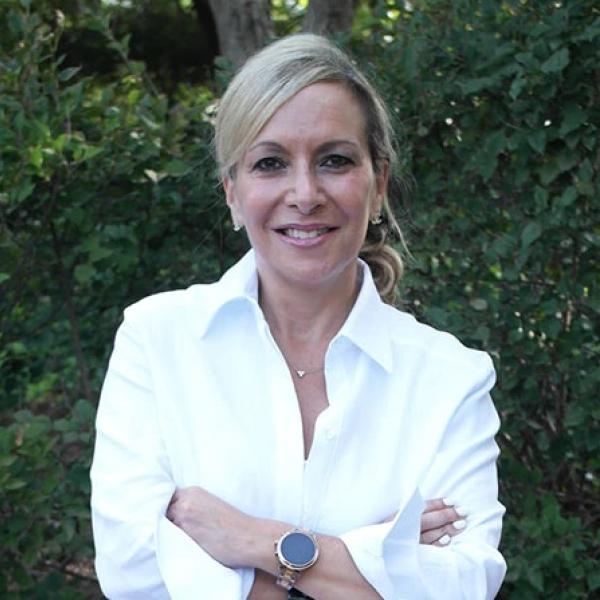 Nestlé employee smiling at the camera 