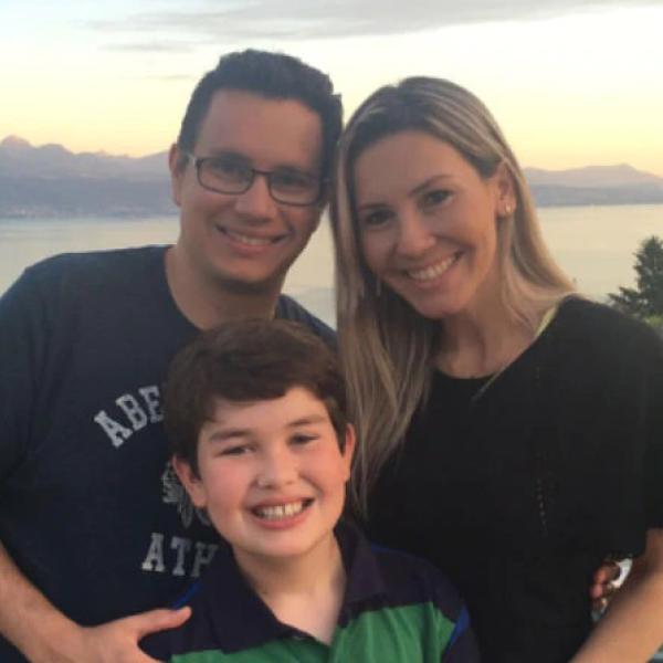 Nestlé employee with family smiling at the camera 