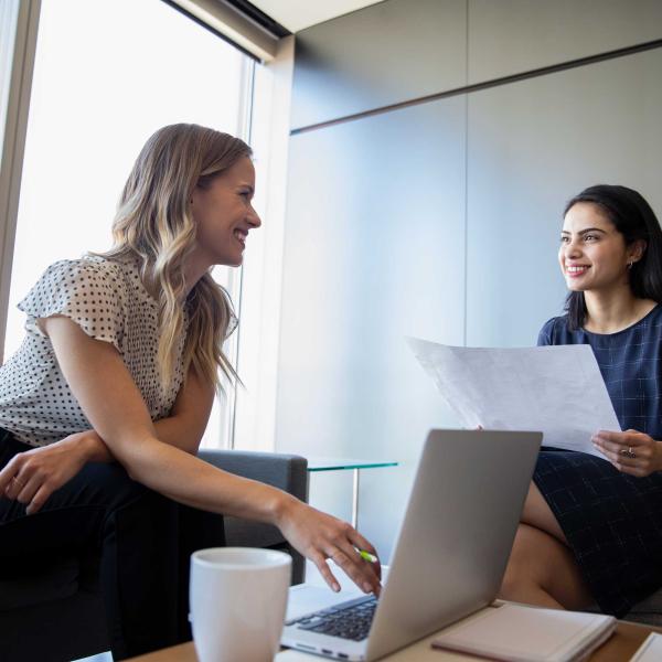 Employees talking with one another