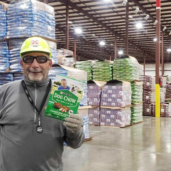 Nestlé Purina associate posing with Dog Chow