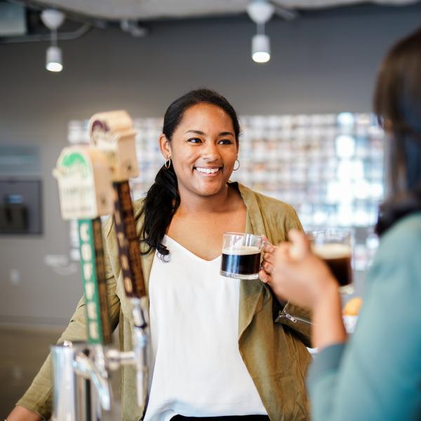 two employees talking over coffee