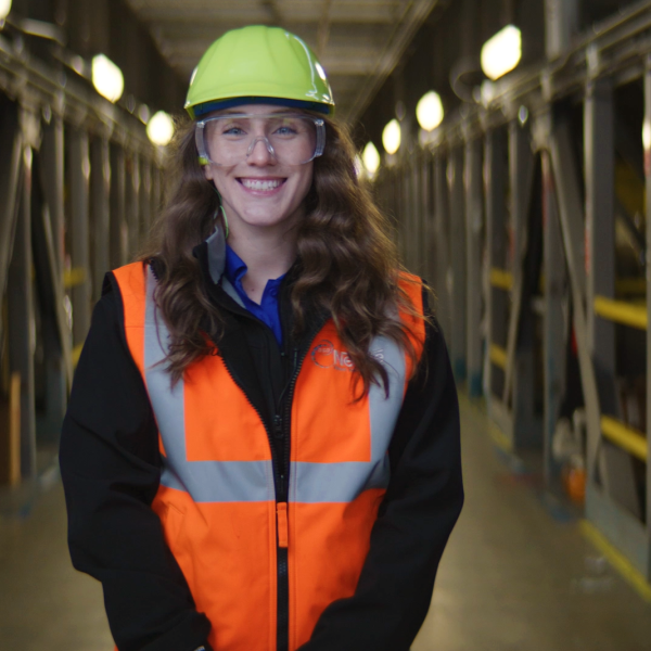 Female warehouse intern smiling