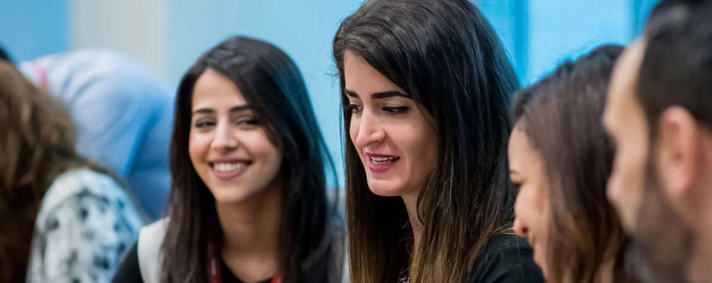 Nestlé employees smiling at the camera  