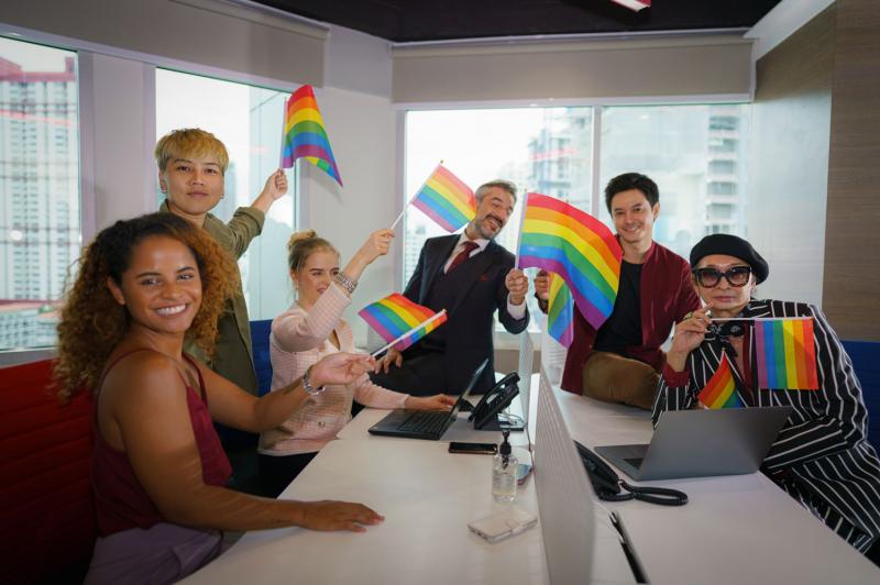 Group of employees with Pride flags