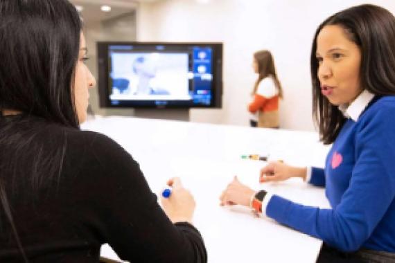 Two Nestle employees sitting a table brainstorming