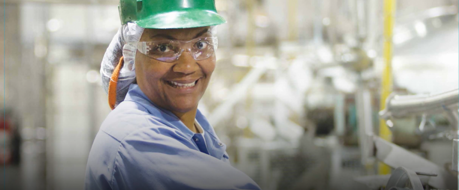 Factory worker smiling at the camera