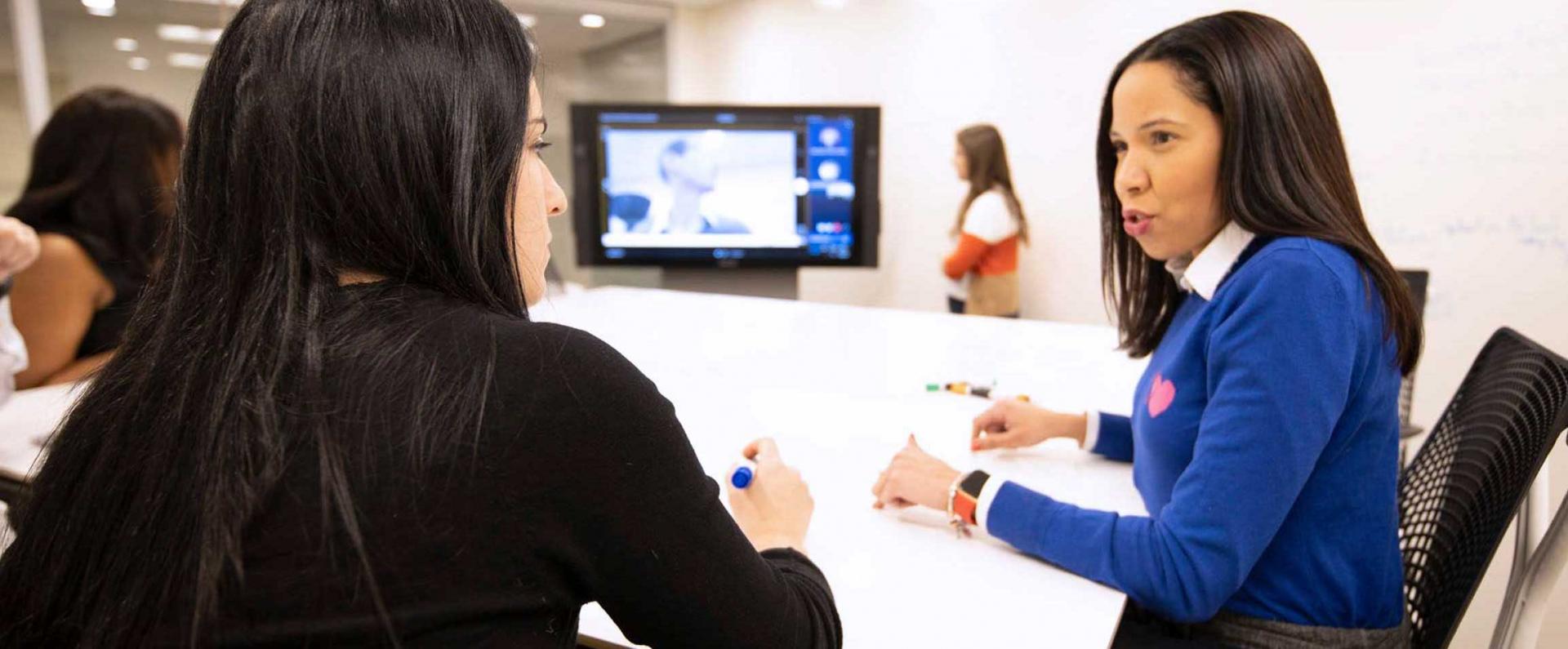 Women discussing at a meeting