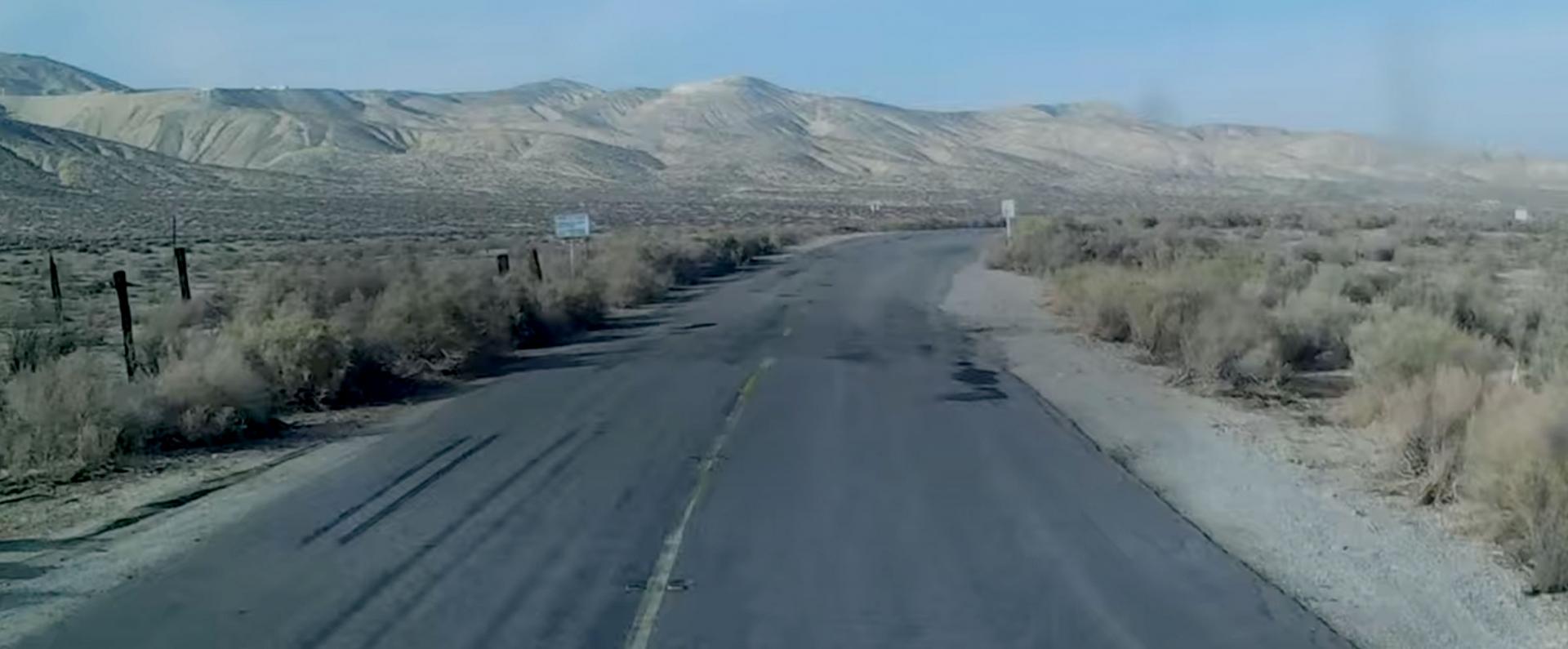 A remote desert road next to mountains in Maricopa, California