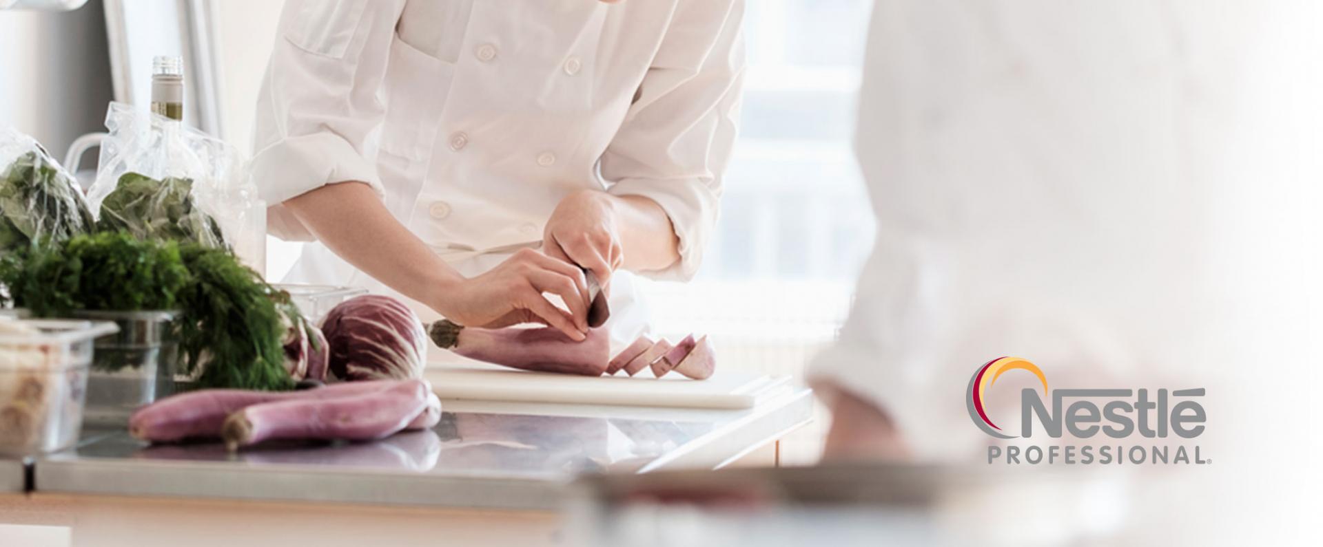 Close up of a chef slicing meat on a table