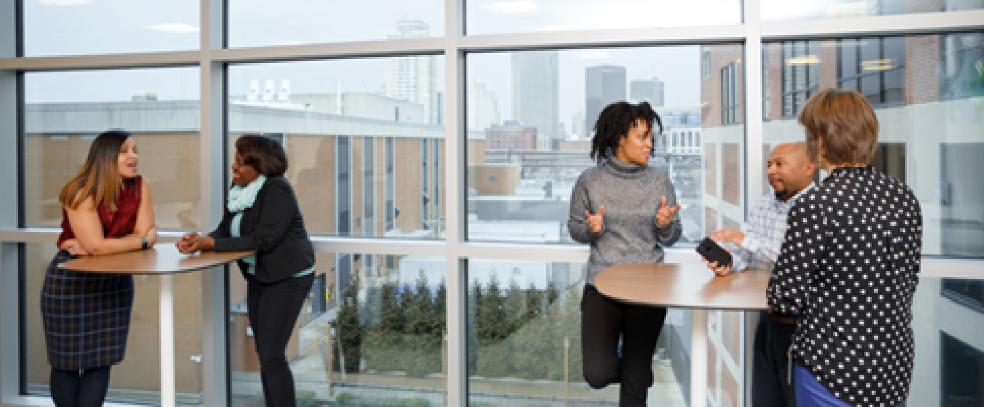 Group of Nestlé teammates networking at office