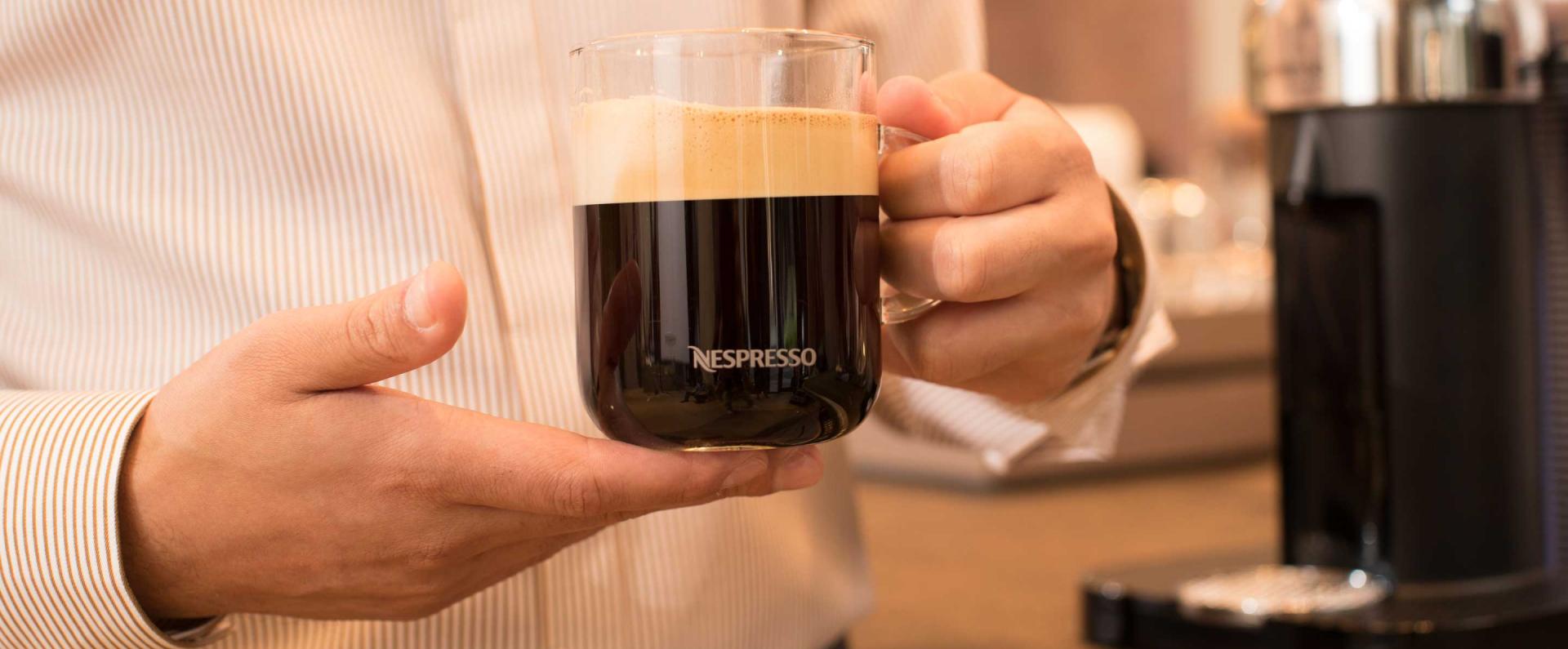 Holding Nespresso mug in hands