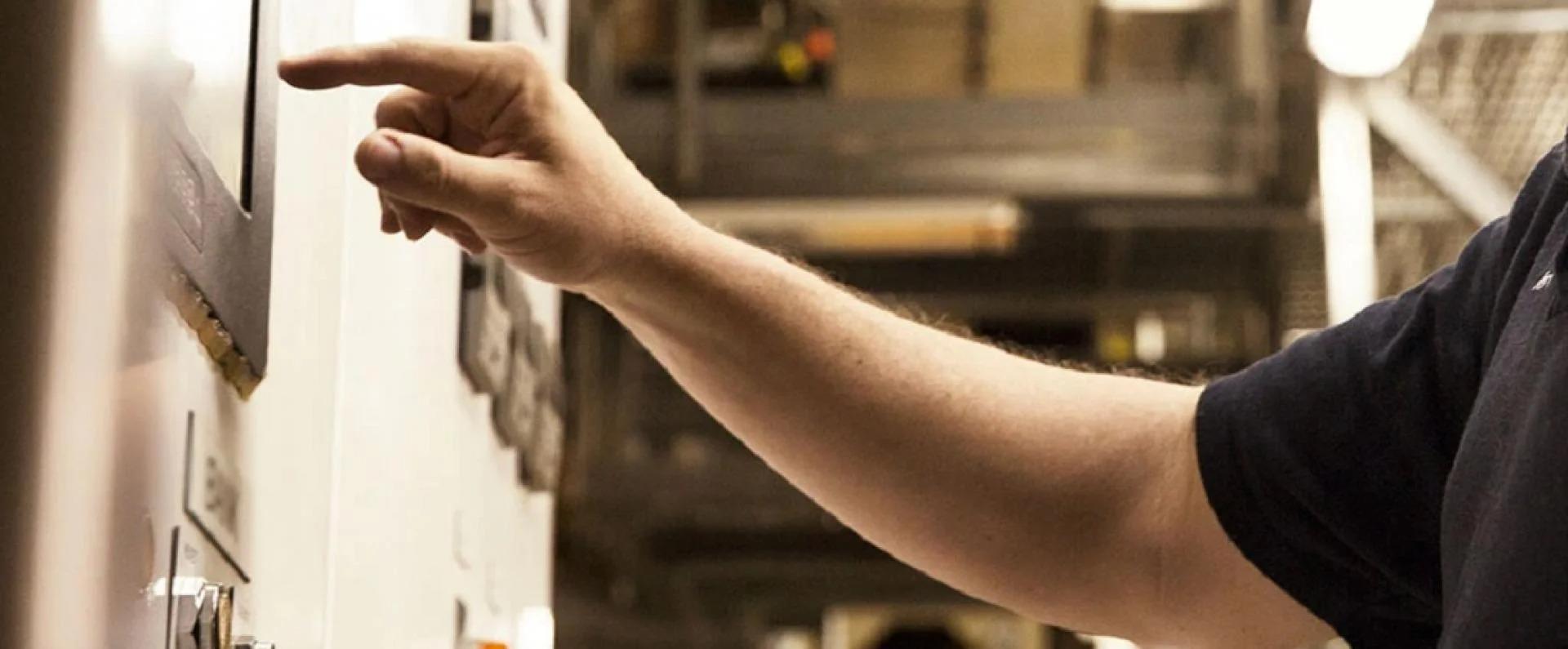 man clocking in to warehouse