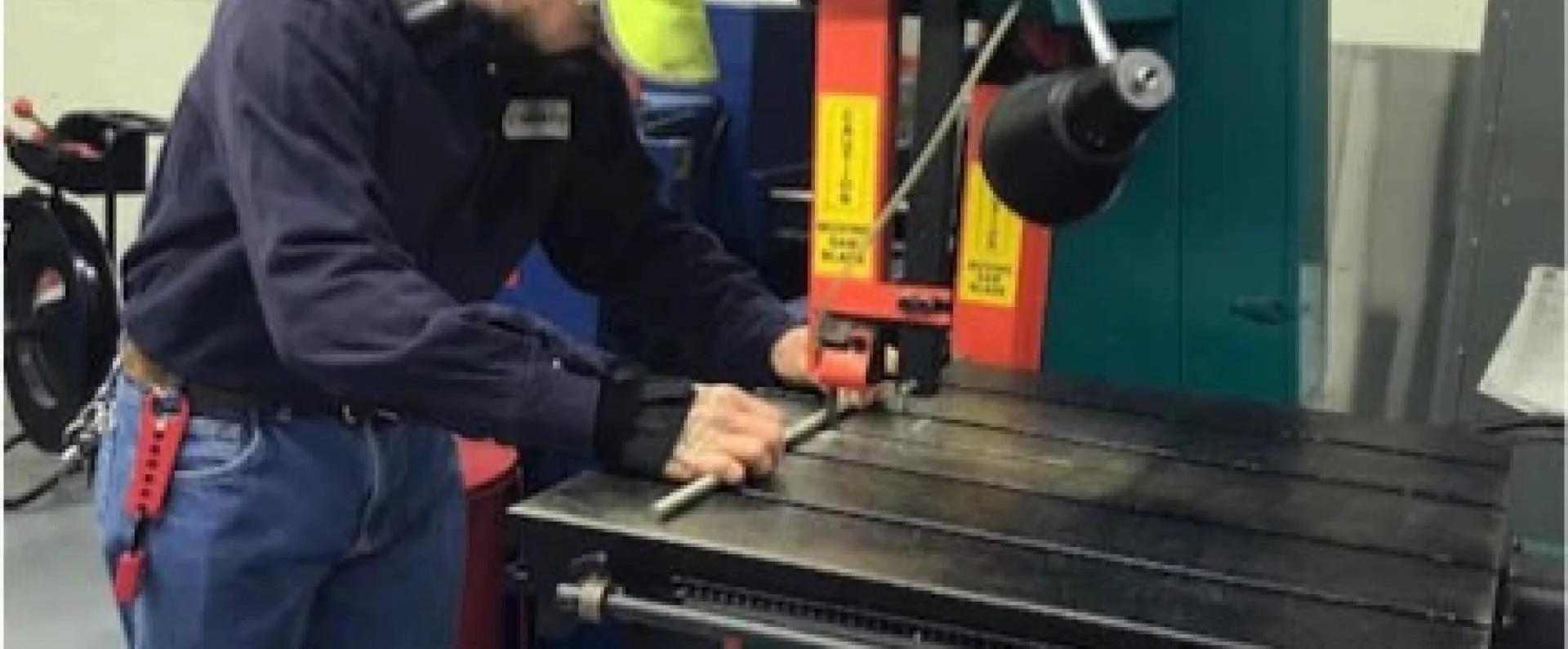 man working on machine in wareshouse