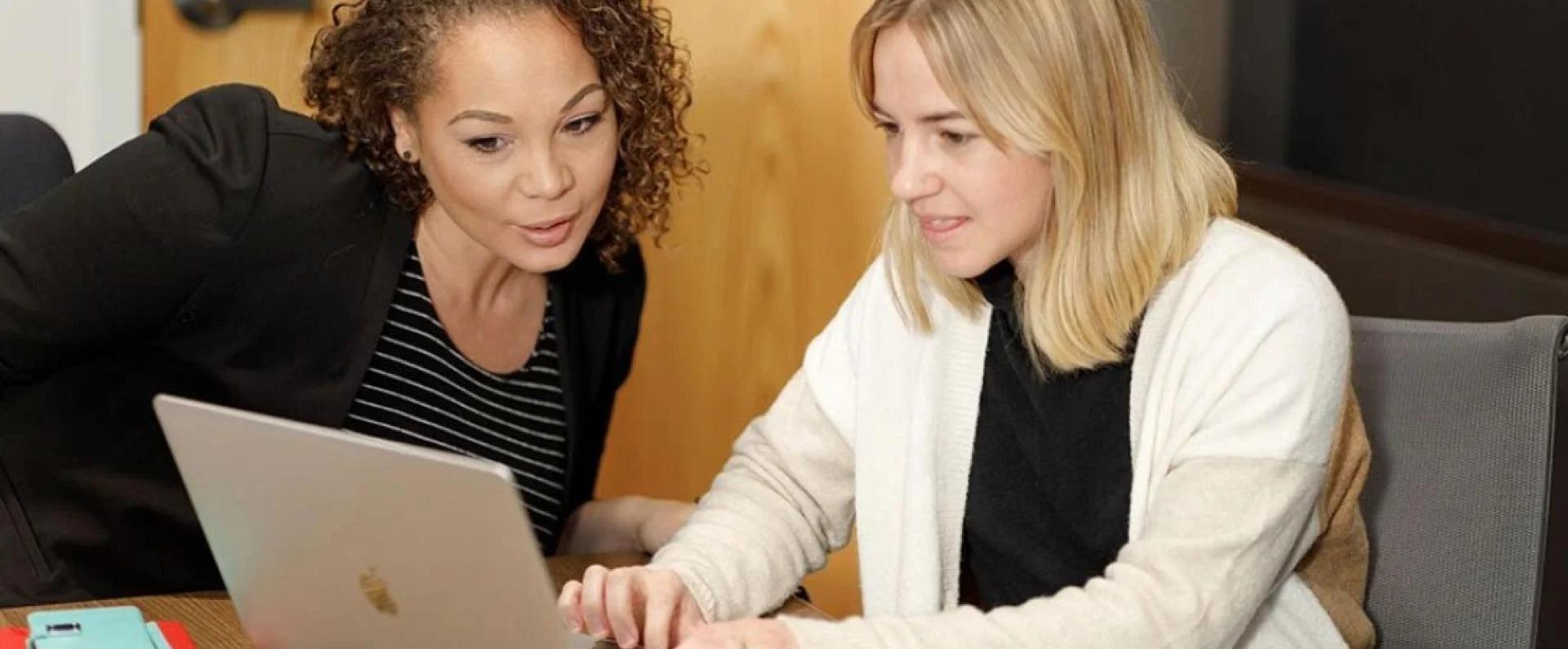 New associates onboarding at laptop