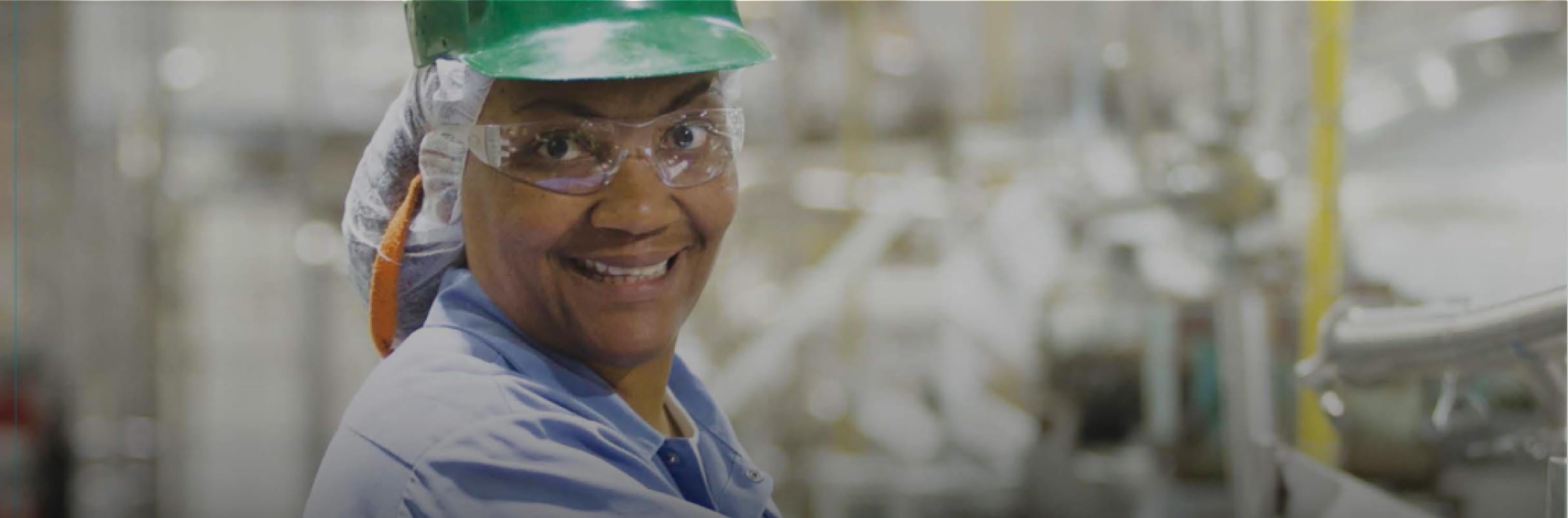 Gerber factory working wearing green hard hat