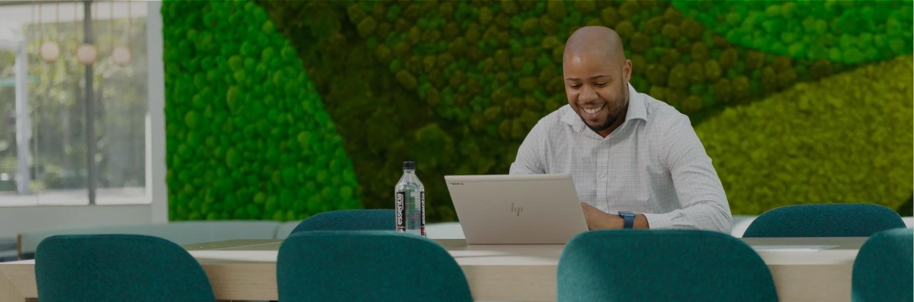 Man sitting at table on laptop